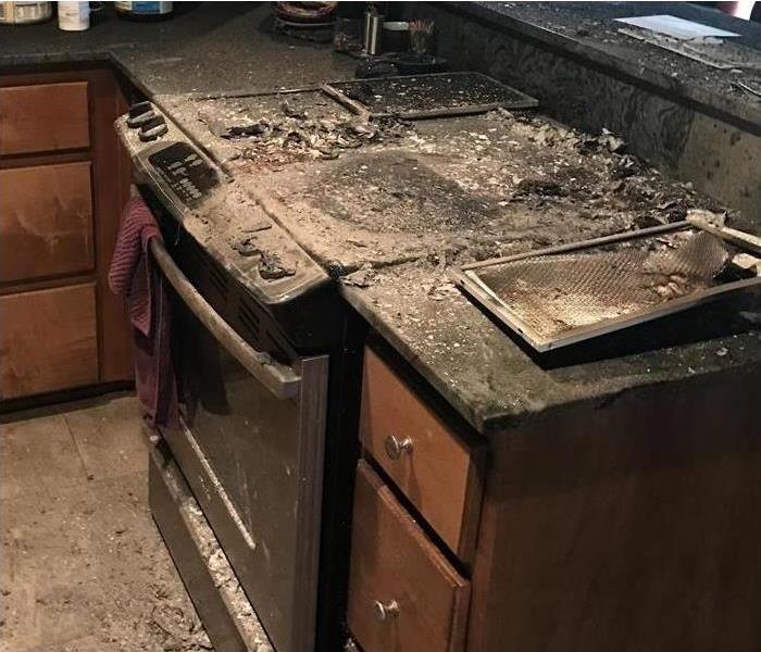 A burned stove in a kitchen