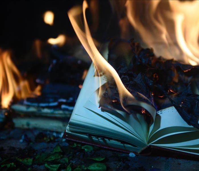 Flames devouring a book