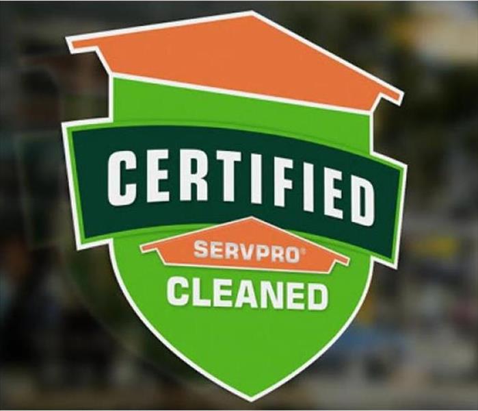 A Certified: SERVPRO Cleaned shield on a business's door