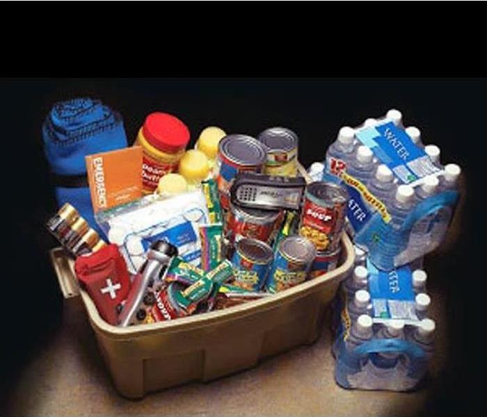 Plastic bin packed with food, water and other supplies to survive a storm.