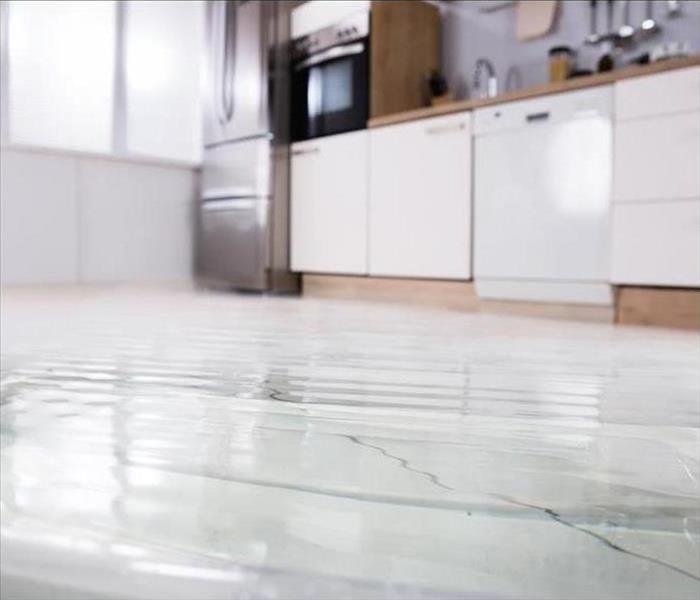 Water covers a kitchen floor